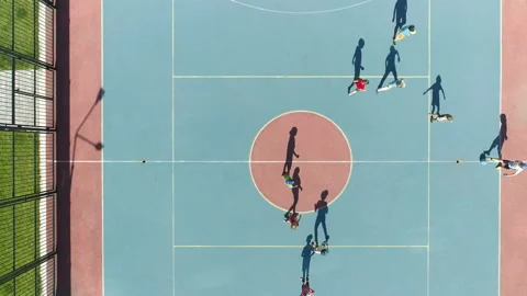 Aerial Top Down View of children playing soccer. Football field playground. Kids Stock-Footage 147529432