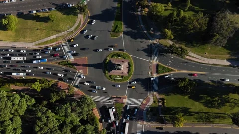 Aerial top-down view of city traffic driving around a roundabout Stock-Footage 335045078