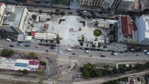 Aerial top down view of city square with roads pedestrians and traffic Stock Footage 337462563