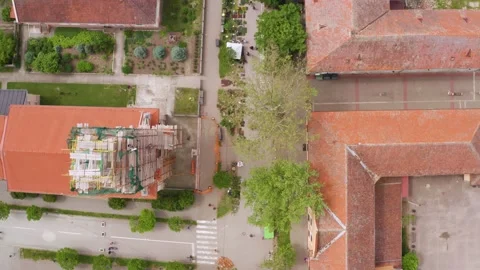 Aerial top-down view of clay tiles roofs in the Serbian city of Novi Sad. Video stock 156365129