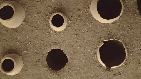 Aerial top down view Clay wine vessels embedded in earth beneath wooden she.. Stock-Footage 311265172
