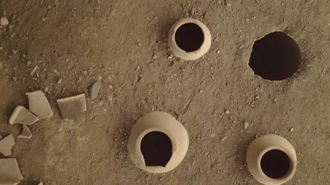 Aerial top down view Clay wine vessels embedded in earth beneath wooden she.. Stock-Footage 324946688
