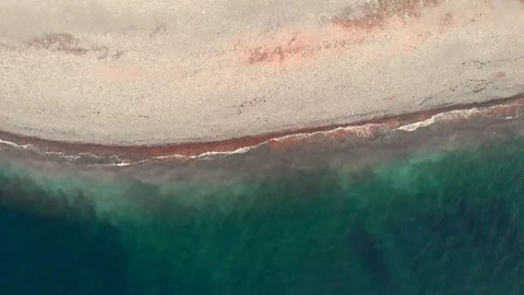 Aerial top down view of clear sandy beach and azure sea or ocean water without Stock Footage 105537908