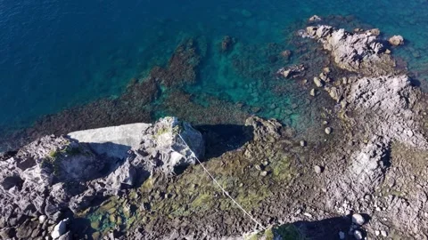 Aerial Top Down View of Clear Water and Rocky Reef on Manazuru Coast Japan Stock Footage 345102183