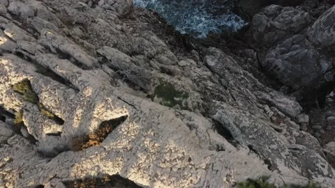 Aerial top down view of cliff over rough sea in Mediterranean Video stock 168770733