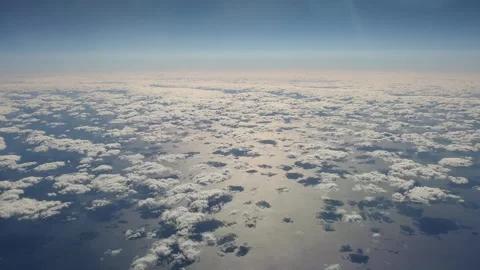 Aerial top down view of clouds reflecting on and moving over sea 库存影片 279442165
