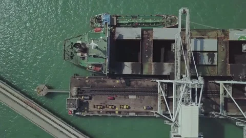 Aerial Top Down View of Coal Bulk Carrier Ship Unloading at Port Terminal Stock-Footage 333728581
