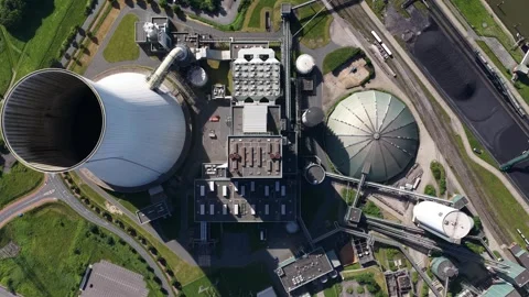 Aerial top down view of a coal fired power plant cooling tower Stock Footage 337447676