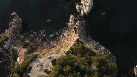 Aerial top-down view of coastal rock formations in Mediterranean island Video stock 168771760