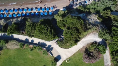 Aerial top down view of coastal park path and beach in Greece Stock Footage 343940785