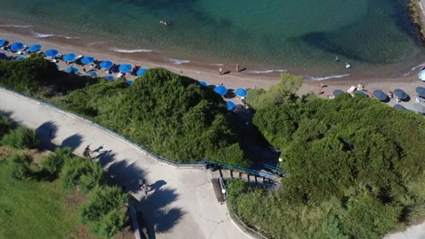 Aerial top down view of coastal park path leading to beach in Greece Stock Footage 343940941