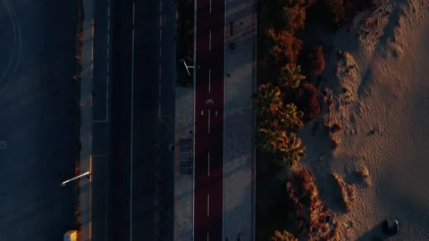 Aerial top down view of coastal road bike lane and beach Stock Footage 344529155