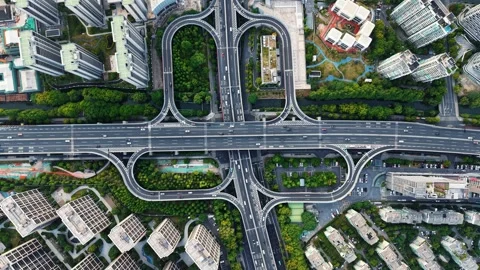 Aerial top down view of a complex junction with multiple lanes and green spaces Stock Footage 311559184