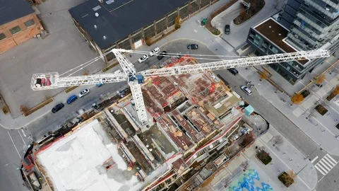 Aerial Top Down View of Condo Construction and Crane. Stock Footage 98434143