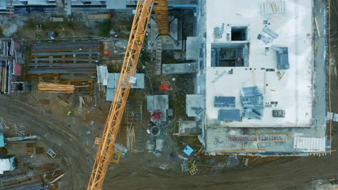 Aerial top down view of a construction site of with an apartment building under Stock Footage 166804088