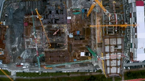 Aerial top down view of construction site with tower cranes working and building Stock Footage 263060555