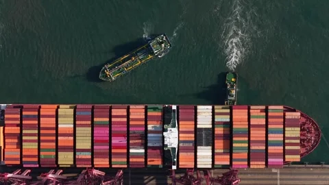 Aerial top down view of container ship docking at port terminal Stock Footage 329429332