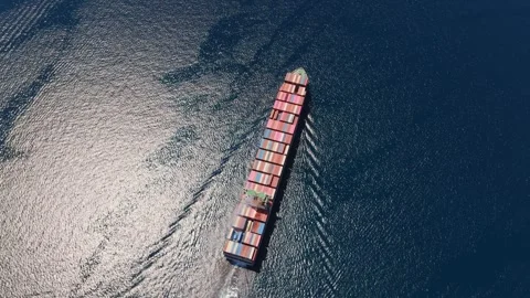 Aerial top-down view of a container ship navigating the ocean 動画素材 336719238