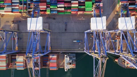 Aerial top-down view of a container ship unloading at a seaport terminal Stock Footage 336754918