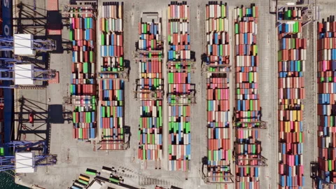 Aerial top down view of containers stacking in a busy port Stock Footage 345006980