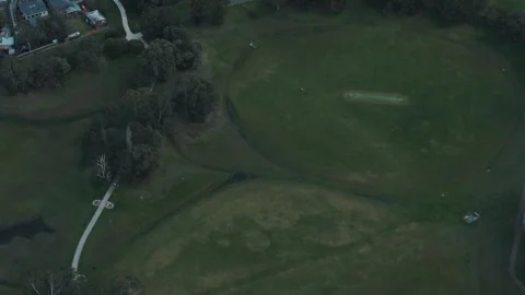 Aerial top-down view of a cricket pitch in a park Video stock 342579406
