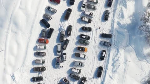 Aerial top down view of crowded ski resort parking lot with cars and 4x4 ve.. Stock Footage 348344583