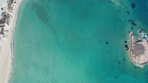 Aerial top down view of crystal clear turquoise sea and sandy seabed Stock Footage 337046526