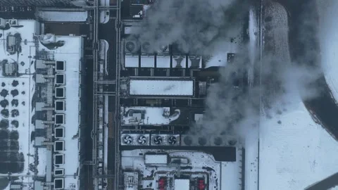 Aerial top down view of a data center emitting steam during winter Stock Footage 327904304
