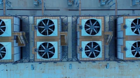Aerial top-down view of a data center cooling system with rotating ventilation Stock Footage 346147531