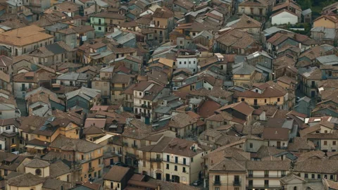 Aerial top-down view of dense historic town rooftops of Serra San Bruno Stock Footage 337626525
