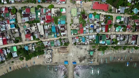 Aerial Top-Down View of Dilapidated Roofs in Barangay Village at Catanduanes 動画素材 313471125