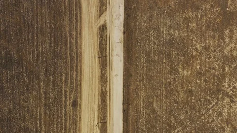 Aerial top down view dirt road in semi-arid climate in Crimea, Meganom Stock Footage 118741808