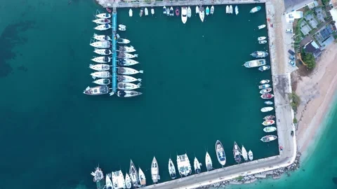 Aerial top-down view of docked sailboats.  Top down view of yachts in the marina 動画素材 203812576