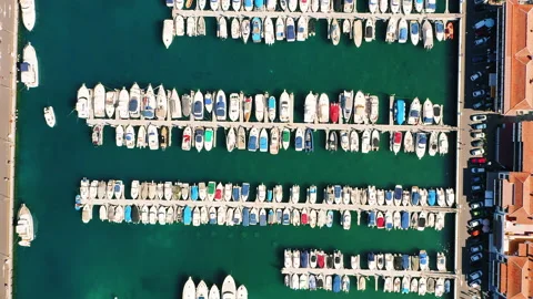 Aerial top down view of docked sailboats, yachts and boats in harbor. Stock Footage 230049342