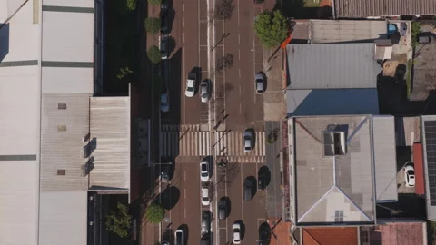 Aerial Top Down View of Downtown Street With Parked Cars and Crosswalk 動画素材 346069543