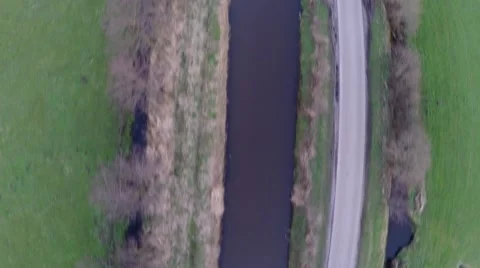 Aerial top down view drone flying over rural road car passing by UAV 4k Stock Footage 60578850
