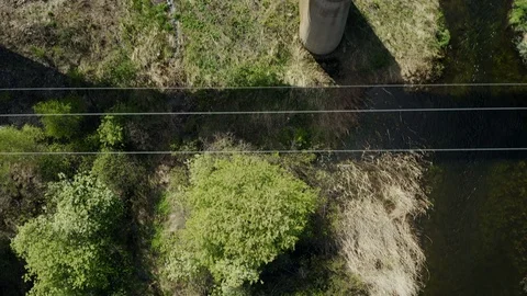 Aerial top down view; drone moving over the old railway bridge Stock Footage 109329506