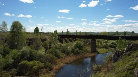 Aerial top down view; drone moving over the old railway bridge Stock Footage 109331265