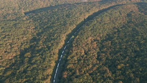 Aerial top down view of a dumper trucks unloading the gravel. 2 dump trucks Stock Footage 141609883