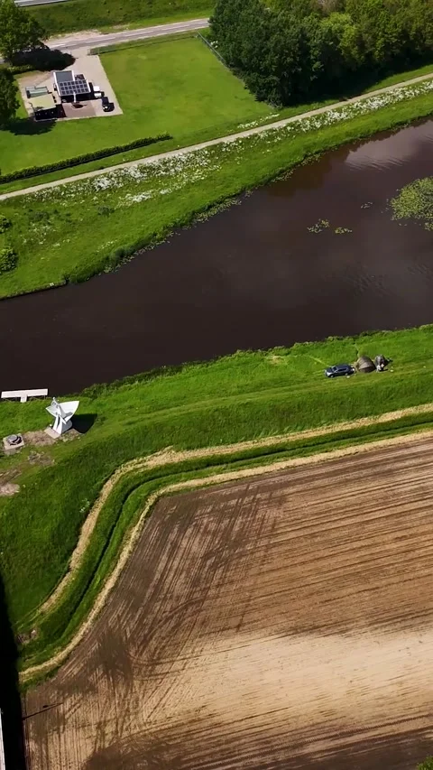 Aerial top-down view of dutch rural landscape with canal and road 库存影片 336496817