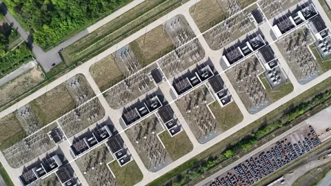 Aerial top down view of electrical power substation infrastructure Видео 334315037