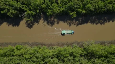 Aerial top down view of empty cargo ship boat navigating through narrow steam Stock-Footage 151822622