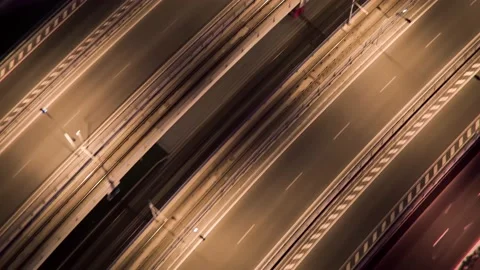 Aerial top down view of an empty bridge illuminated at night, city-lights Video stock 199673958