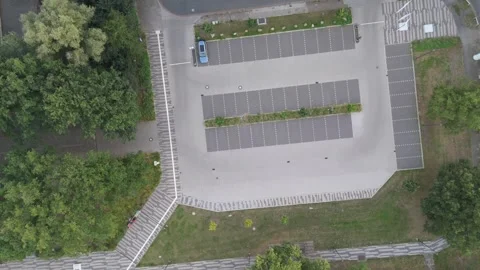 Aerial top down view of an empty parking lot with trees near Bremen Germany 動画素材 336858234