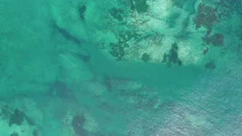 Aerial top down view of endless turquoise sea surface Stock Footage 168660240
