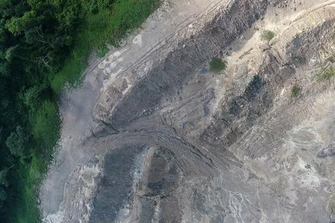 Aerial top-down view of an eroded earth slope displaying complex drainage Stock Photos