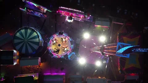 Aerial top down view of fair showing several funfair attractions 4k Stock Footage 167754118