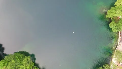 Aerial top-down view of the famous Blue Lake in Kabardino-Balkaria Stock Footage 338015128