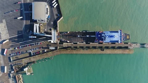 Aerial top down view of ferry disembarking showing trucks 4k Stock Footage 120671368