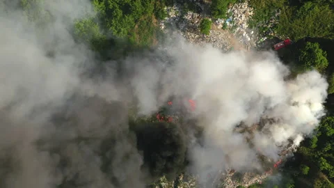 Aerial top down view from fire at garbage dump, 4k Stock Footage 135961821